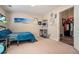 Bright bedroom with comfy bed, wall art, and access to a bonus room at 4851 Planters Walk, Douglasville, GA 30135