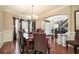 Formal dining room with hardwood floors, chandelier, and access to the foyer at 4851 Planters Walk, Douglasville, GA 30135