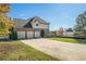 Two-story house with three-car garage and large backyard at 4851 Planters Walk, Douglasville, GA 30135