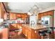 Modern kitchen with granite countertops, wood cabinets, and stainless steel appliances at 4851 Planters Walk, Douglasville, GA 30135