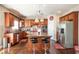 Spacious kitchen with an island, granite countertops, and wood cabinets at 4851 Planters Walk, Douglasville, GA 30135