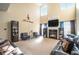Two-story living room featuring a fireplace, large windows, and ample seating at 4851 Planters Walk, Douglasville, GA 30135