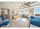 Main bedroom with high ceilings, ceiling fan, and large windows at 4851 Planters Walk, Douglasville, GA 30135
