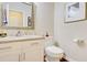Updated bathroom with granite countertop, white cabinets, and a toilet at 729 River Bridge Dr, Lawrenceville, GA 30046
