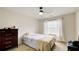 Cozy bedroom with a full-size bed and dresser at 729 River Bridge Dr, Lawrenceville, GA 30046