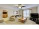 Bright bonus room featuring a comfy couch and large TV at 729 River Bridge Dr, Lawrenceville, GA 30046