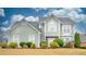 Beautiful two-story house with light green vinyl siding and manicured lawn at 729 River Bridge Dr, Lawrenceville, GA 30046