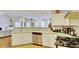 Open concept kitchen with granite counters, stainless steel appliances, and white cabinets at 729 River Bridge Dr, Lawrenceville, GA 30046