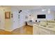 Kitchen features granite countertops and a breakfast bar overlooking Gathering room at 729 River Bridge Dr, Lawrenceville, GA 30046