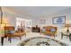Living room featuring hardwood floors, comfortable seating, and a decorative rug at 729 River Bridge Dr, Lawrenceville, GA 30046