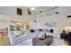 Two-story living room with hardwood floors, sectional sofa, and high ceilings at 729 River Bridge Dr, Lawrenceville, GA 30046