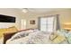 Main bedroom with a king-size bed and large window at 729 River Bridge Dr, Lawrenceville, GA 30046