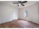 Spacious bedroom with ceiling fan and large window at 1326 Elm Cir, Stockbridge, GA 30281