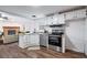 Modern kitchen features stainless steel appliances and white cabinets at 1326 Elm Cir, Stockbridge, GA 30281