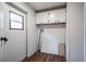 Bright laundry room with upper cabinets and exterior access at 1326 Elm Cir, Stockbridge, GA 30281