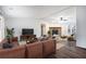 Open concept living room with a stone fireplace and built-in shelving at 1326 Elm Cir, Stockbridge, GA 30281