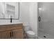 Bathroom with light wood vanity, white toilet and walk-in shower at 3921 Enclave Way, Tucker, GA 30084