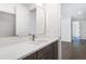 Modern bathroom with a white quartz vanity and gold fixtures at 3921 Enclave Way, Tucker, GA 30084