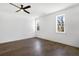 Spacious bedroom featuring hardwood floors and large windows at 3921 Enclave Way, Tucker, GA 30084