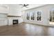 Living room with fireplace, built-ins, hardwood floors and access to backyard at 3921 Enclave Way, Tucker, GA 30084