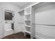 Large walk-in closet with built-in shelves and hanging rods at 3921 Enclave Way, Tucker, GA 30084