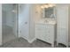 Bathroom with vanity, linen closet, and view of bedroom at 601 Ashton Ln, Lawrenceville, GA 30044