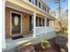 Home features a dark brown front door, brick accents and a white porch at 601 Ashton Ln, Lawrenceville, GA 30044