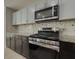 Modern kitchen with stainless steel appliances and granite countertops at 601 Ashton Ln, Lawrenceville, GA 30044