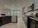 Modern kitchen with stainless steel appliances and granite countertops at 601 Ashton Ln, Lawrenceville, GA 30044