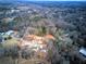Even wider aerial view of the neighborhood development surrounded by lush greenery and trees at 96 Rome St, Temple, GA 30179