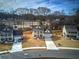 Aerial view of the homes showcasing the spacious lots and newly paved road and driveways at 96 Rome St, Temple, GA 30179