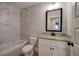 Bathroom showcasing marble-look tile, a granite vanity top, and modern fixtures for a luxurious feel at 96 Rome St, Temple, GA 30179