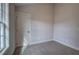 Neutral bedroom with a window and a view of the outdoors at 96 Rome St, Temple, GA 30179