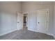 Neutral bedroom with carpet and painted trim, showcasing the home's design with white doors and trim at 96 Rome St, Temple, GA 30179