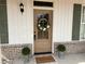 Charming front entrance featuring a wood door with glass, a wreath, and a 'Welcome' mat at 96 Rome St, Temple, GA 30179