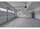 Spacious, two-car garage with neutral paint, concrete floors, water heater, and interior door to the home at 96 Rome St, Temple, GA 30179