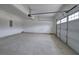 Spacious two-car garage with a concrete floor and white walls, offering plenty of room for storage and vehicles at 96 Rome St, Temple, GA 30179
