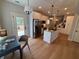 Bright kitchen with stainless steel appliances, white cabinets, granite countertops and center island at 96 Rome St, Temple, GA 30179