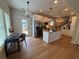 Modern kitchen featuring stainless steel appliances, a kitchen island, and hardwood floors at 96 Rome St, Temple, GA 30179