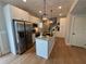 Modern kitchen featuring stainless steel appliances, granite countertops, a center island, and ample cabinet space at 96 Rome St, Temple, GA 30179