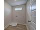 Well-lit laundry room with a window and hookups ready for appliances, offering practicality and convenience at 96 Rome St, Temple, GA 30179