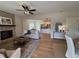 Cozy living room featuring a fireplace, hardwood floors, and an open layout at 96 Rome St, Temple, GA 30179