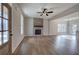 Spacious living room with fireplace, hardwood floors, and lots of natural light at 96 Rome St, Temple, GA 30179