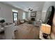 Open-concept living space with a dining area, living room, and hardwood floors at 96 Rome St, Temple, GA 30179