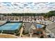 Aerial of community pool, clubhouse, and tennis courts at 2429 Sardis Chase Ct, Buford, GA 30519