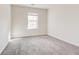 Well-lit bedroom, featuring neutral walls and carpet at 2429 Sardis Chase Ct, Buford, GA 30519