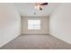 Spacious bedroom with neutral carpeting and a large window at 2429 Sardis Chase Ct, Buford, GA 30519