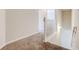 Upstairs hallway with carpeted floors and white railings at 2429 Sardis Chase Ct, Buford, GA 30519