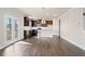 Open concept kitchen with island and dark cabinets at 3807 Lockaby Way, Lawrenceville, GA 30044