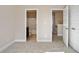 Bedroom with carpet, an ensuite bathroom, and access to hallway at 3807 Lockaby Way, Lawrenceville, GA 30044